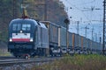 Class 182 Siemens TAURUS locomotive drives a freight train with semi-trailers through Gemuenden