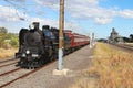 A-class steam engine hauling red rattler carriages at Sunshin Royalty Free Stock Photo