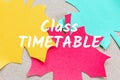 Class timetable on colored paper autumn leaves background