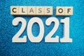 Class of 2021 word alphabet letters on blue glitter background