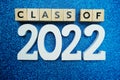 Class of 2022 word alphabet letters on blue glitter background