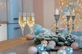 Classes of champagne surrounded by Christmas New year background and decoration, light bokeh effect Royalty Free Stock Photo