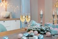 Classes of champagne on a table surrounded by Christmas New year background and decoration, light bokeh effect Royalty Free Stock Photo