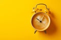 Classic alarm clock with coffee instead of a clock face isolated on a yellow background with copy space. Coffee break, morning Royalty Free Stock Photo