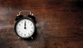 Classic alarm clock noon time on wood Royalty Free Stock Photo