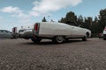 Classic american Cadillac car in store parking. Rear detail of white luxury retro vintage automobile headlight Royalty Free Stock Photo