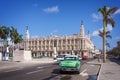 Classic american car on Paseo del Prado, Gran theatro de la Havana in the background