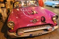 Classic American car with a picture of Che Guevara on the street of Havana, Cuba