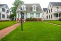 Classic American house with a brick sidewalk leading to the front door