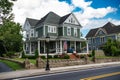 classic American house colonial style. Veranda with columns and flag at entrance Royalty Free Stock Photo