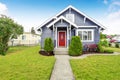 Classic American house with siding trim and red entry door Royalty Free Stock Photo