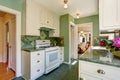 Classic American kitchen room interior in green and white tones Royalty Free Stock Photo