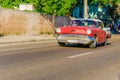 Classic American red car in Havana, Cuba Royalty Free Stock Photo
