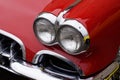 Classic American retro car bumper and headlight of red vintage car muscle Royalty Free Stock Photo