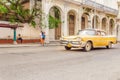 Classic American yellow car on street of Havana