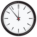 Classic analog clock face showing nearly noon or midnight with sharp black hands and markers Royalty Free Stock Photo
