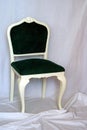 Classic or antique green velvet and white wood chair