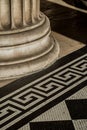 Classic architectural detail of support column and mosaic tiling.