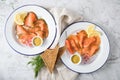 Classic and Asian style Gravlax a raw, marinated graved salmon with lemongras, chili, dill with toast bread, Scandinavian mustard