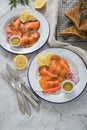 Classic and Asian style Gravlax a raw, marinated graved salmon with lemongras, chili, dill with toast bread, Scandinavian mustard