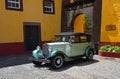 Classic Austin 12 Motor Car parked at Sao Tiago Fort: the pretty yellow fort at Funchal.