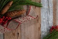 Authentic and rustic Christmas holiday decorations on weathered wood Royalty Free Stock Photo