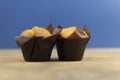 Classic banana nut muffins black paper wrapper on wooden table