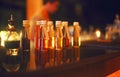 Classic bar counter with bottles in blurred background Royalty Free Stock Photo