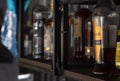 Classic bar counter with bottles of different alcohol Royalty Free Stock Photo