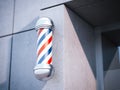 Classic Barber shop Pole on the wall. 3d rendering