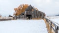 Classic barn on a farm in Idaho with the snow of winter on the g