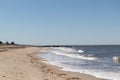 This is a classic beach shot taken at Cape May New Jersey. The pretty waves with the whitecaps. The sand riddles with pebbles.