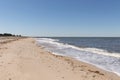 This is a classic beach shot taken at Cape May New Jersey. The pretty waves with the whitecaps. The sand riddles with pebbles.
