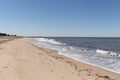 This is a classic beach shot taken at Cape May New Jersey. The pretty waves with the whitecaps. The sand riddles with pebbles.