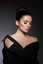 Classic beauty portrait of woman with perfect evening makeup on dark background. Perfect skin without wrinkles, professional Royalty Free Stock Photo