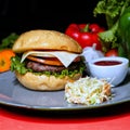 Classic beef Burger with sauce and salad served in dish side view of fastfood Royalty Free Stock Photo