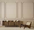 Classic beige interior with dresser, lounge chair, moldings and decor. Royalty Free Stock Photo