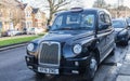 Classic black British taxi in South Westwood.