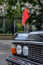 Classic black car with the flag of the USSR on the hood Royalty Free Stock Photo