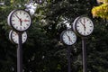 Classic black and white analog clocks with synchronized time show teamwork and synced project management with time management and