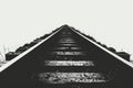 A classic black and white image of an old train track in the wilderness Royalty Free Stock Photo