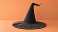 Classic black witch hat on an orange background Royalty Free Stock Photo