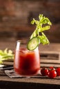 Classic bloody mary or virgin mary vodka cocktail in a cup with as a hangover drink in a rustic envrionment Royalty Free Stock Photo