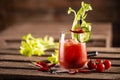 Classic bloody mary or virgin mary vodka cocktail in a cup with as a hangover drink in a rustic envrionment Royalty Free Stock Photo