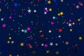 Classic blue abstract background. Festive concept. Color of the year 2020 concept. Colorful confetti in shape of star sparkling on Royalty Free Stock Photo