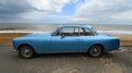 Classic Blue Alvis Motor Car Parked on Seafront Promenade.