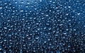 Classic Blue background. Color of the year 2020. The texture of rain drops on the glass close-up. Macro transparent water drops on Royalty Free Stock Photo