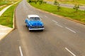 Classic blue car on Cuban street Royalty Free Stock Photo