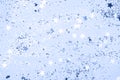 Classic blue confetti and stars and sparkles on blue background. Royalty Free Stock Photo