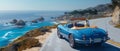 Classic blue convertible cruising along a scenic coastal road with ocean views